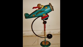 Vintage Flying ace pilot in airplane steel metal balancing toy