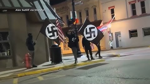 Group of masked men with Nazi flags disrupted play performance about Anne Frank