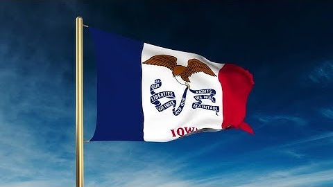 4K iowa flag slider style. Waving in the win with cloud background animation Stock video