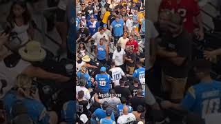 Fans fight in the stands at L.A. Chargers vs. Las Vegas Raiders game
