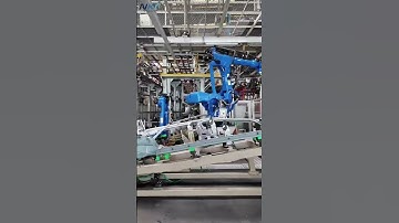Our 2T payload walking rail and fixture, equipped with Yaskawa robots, are used for handling,hemming