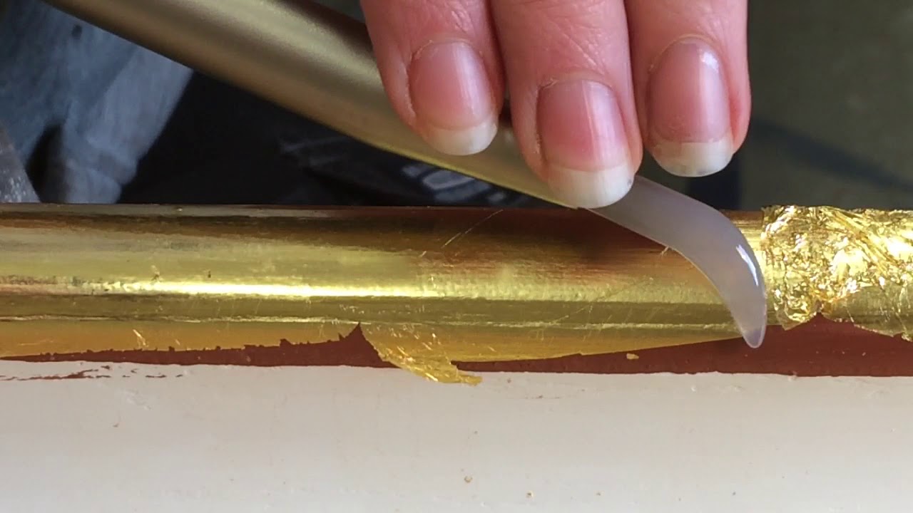 What can you use to burnish gold leaf?