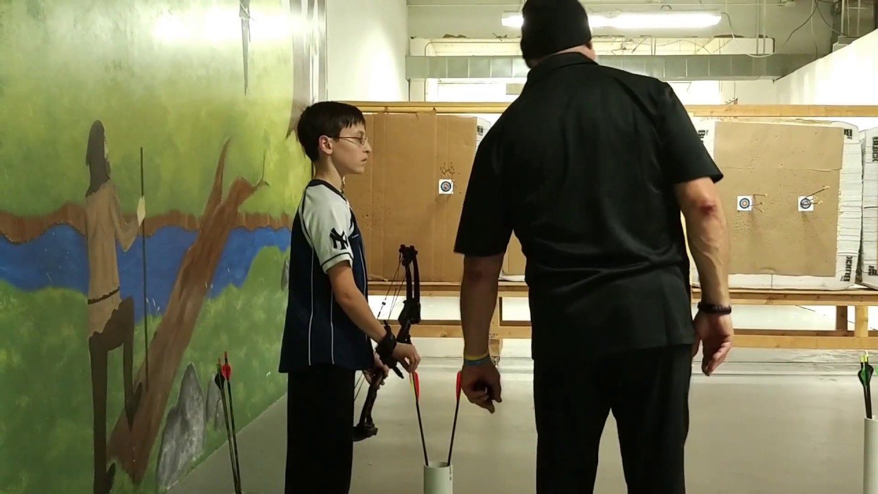 Matthew Shooting at Pea-sized Target at C&B Archery in Hicksville, NY - YouTube