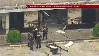 Woman drives car into front of massage business in N. Houston