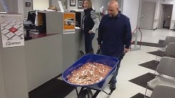 Man Pays Nearly $3,000 Bill Using A Wheelbarrow Full Of Pennies 