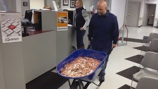 Man Pays Nearly $3,000 Bill Using A Wheelbarrow Full Of Pennies