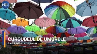 Curcubeul de umbrele îi va proteja de soare