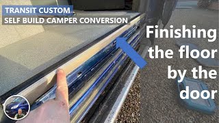 Professional finish of flooring by sliding door in the Transit Custom Conversion