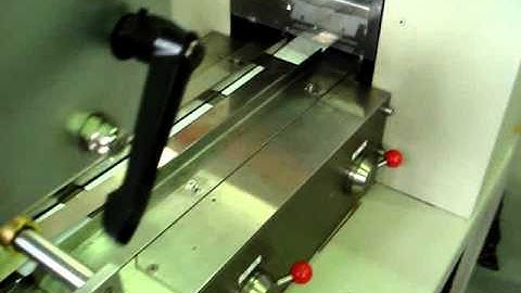 Horizontal flow wrapper with card feeder