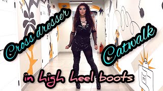 Crossdresser catwalk in high heel boots