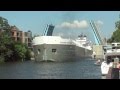 Manitowoc Great Lakes Freighter Navigates Narrow Channel In Manistee Michigan