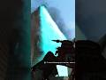 Godzilla having fun blasting the Big City!