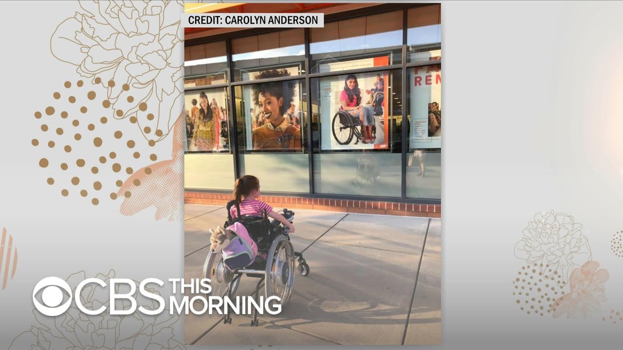 4-year-old in wheelchair in awe of Ulta model who is also in a wheelchair