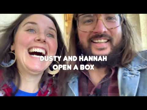 Dusty Slay and Hannah Slayish open a box