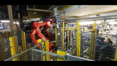 COMAU robot - panoramic roof montage, handling application implemented by RBS Robotics