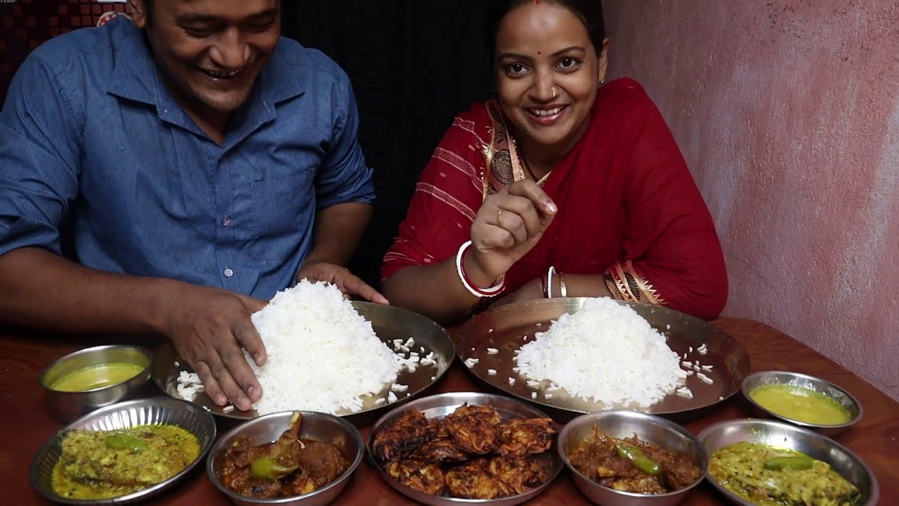 Couple Eating Show Rice with Makhmali Mutton Mango Katla Fish