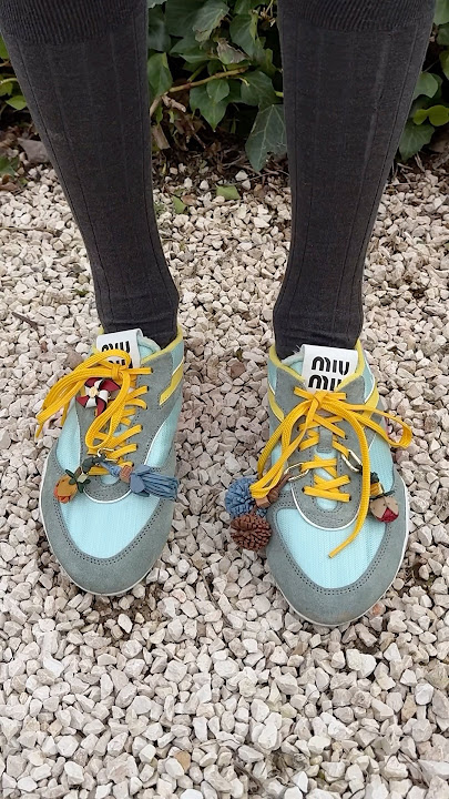 Irreverent charms enrich the Gymnasium sneakers for Miu Miu L’Eté 2025 season.