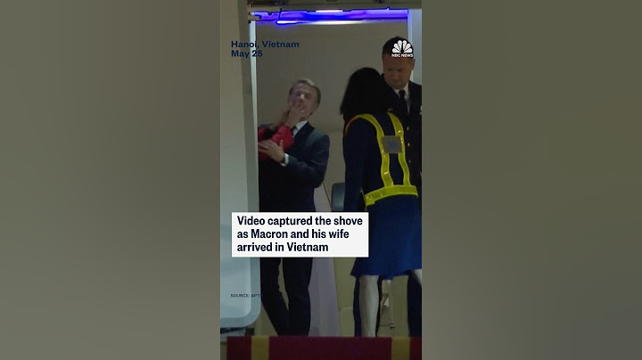 French President Emmanuel Macron's office is downplaying the moment his face was shoved