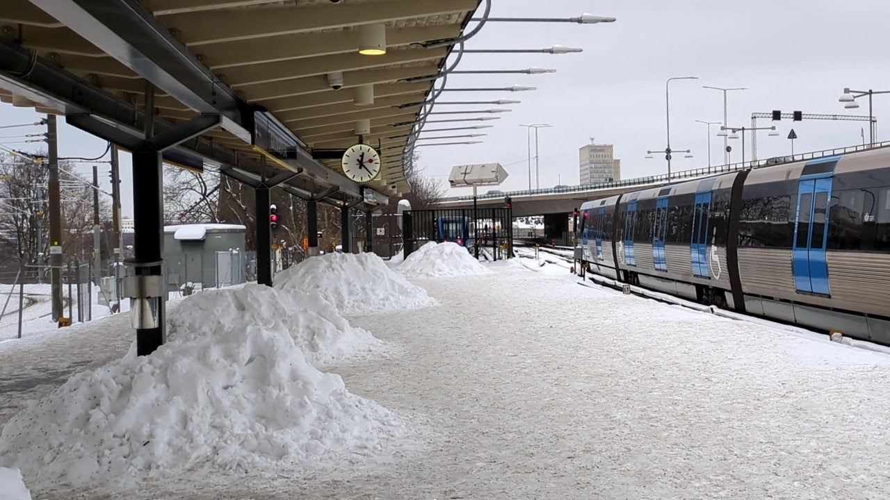 Snow piles on platforms, Gullmarsplan station, Stockholm, for Tvärbanan trams and the metro.