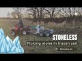 Picking stone in frozen soil