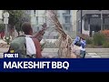 Man seen grilling on shopping cart using sword as a skewer in Santa Monica