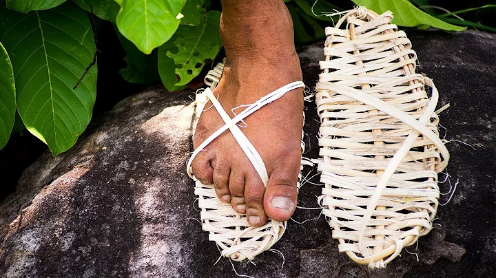 Primitive Technology: Wilderness man making Sandals in the mountain