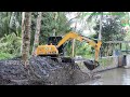 Mini Excavator Clearing The Irrigation Sedimentation