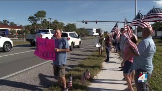 Dozens protest outside Northrop Grumman in St. Augustine over vaccine mandate