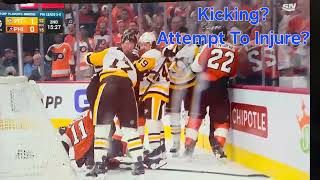 Travis Konecny kicks at Bryan Rust with his skates