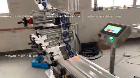 Empty glass bottle flat surface automatic top labeling machine label applicator line running video