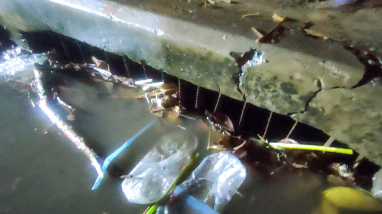 Unclogging Culvert Drain Water On Road Street After Heavy Rain - YouTube