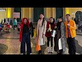 Walking Macao Square tasting free street delicacies, smiling, bonding, and enjoying every bite today