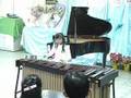 Playing marimba in class (Marn Lin, 9 y/o)