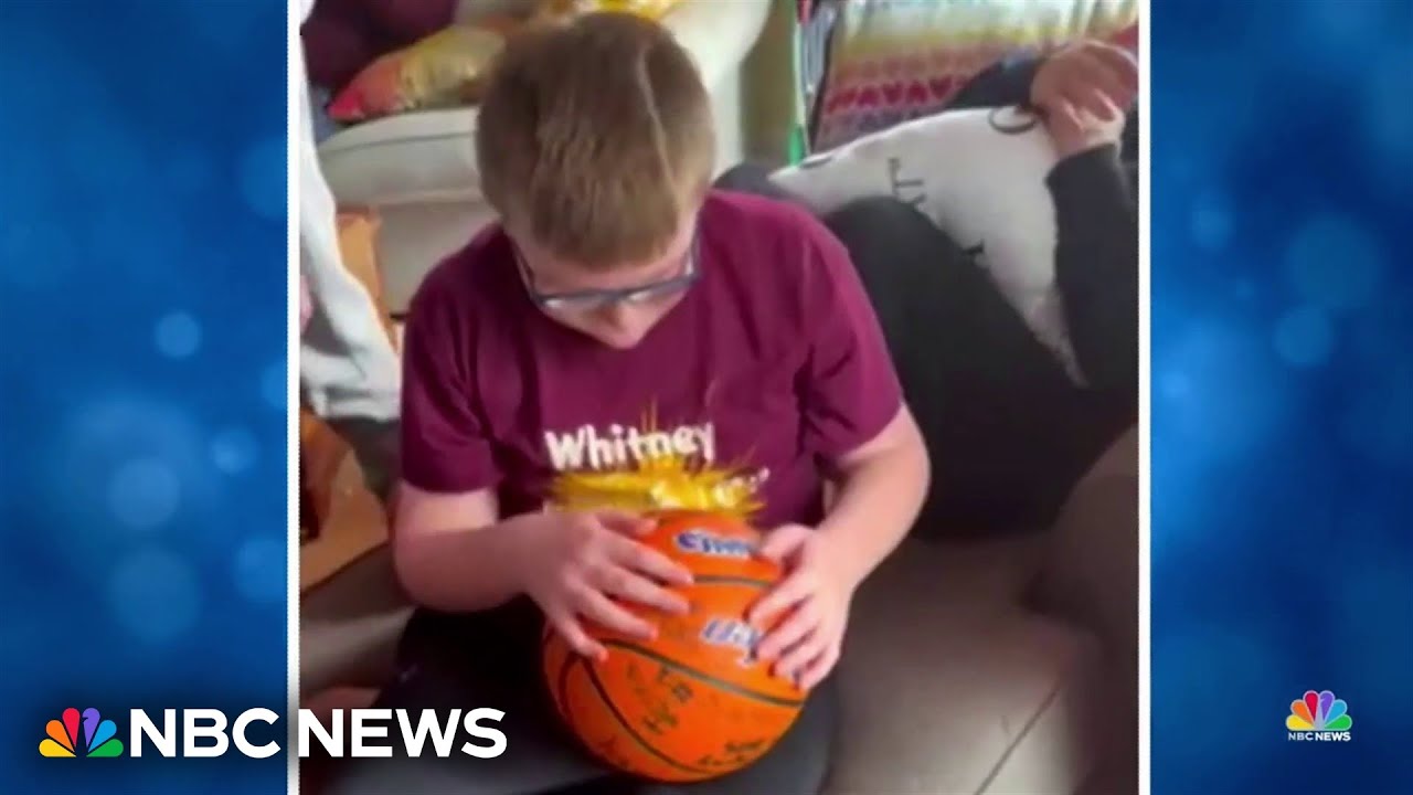 High school varsity basketball team surprises 10-year-old superfan on his birthday