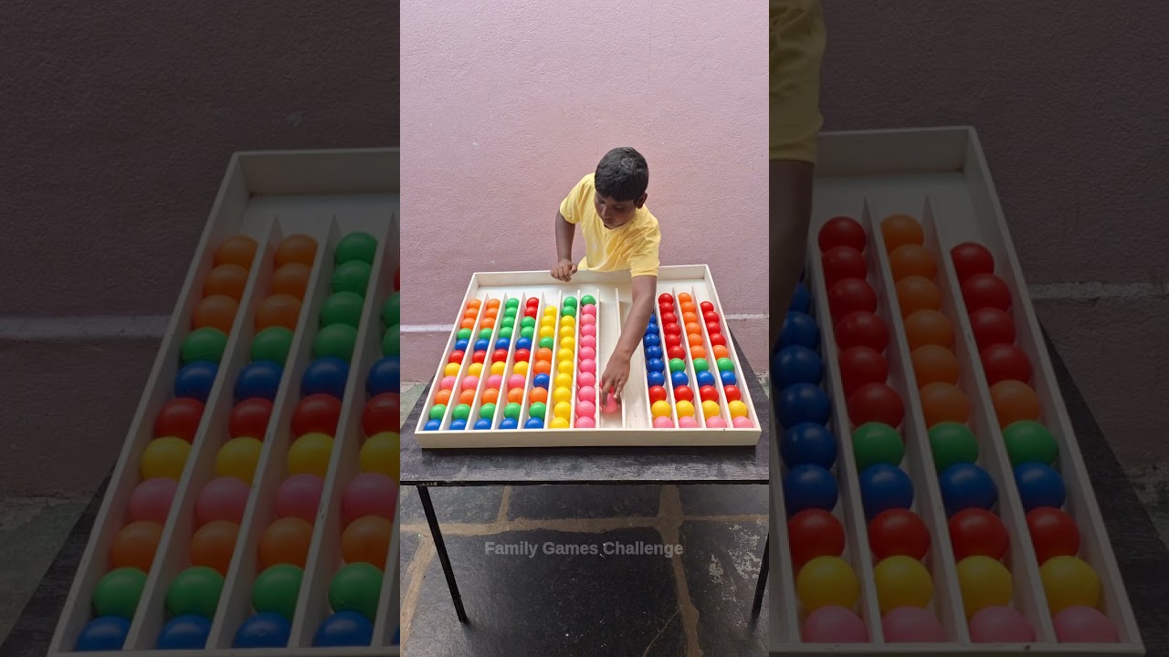 Clever boy playing amazing strategy sorting color ball game solve challenge 