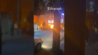 Moment fires ignite in Tehran street after Israel bombs oil depots