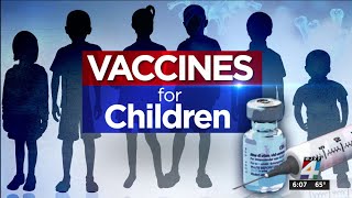 Children age 5 & older roll up sleeves for second dose shots at DCPS vaccination event