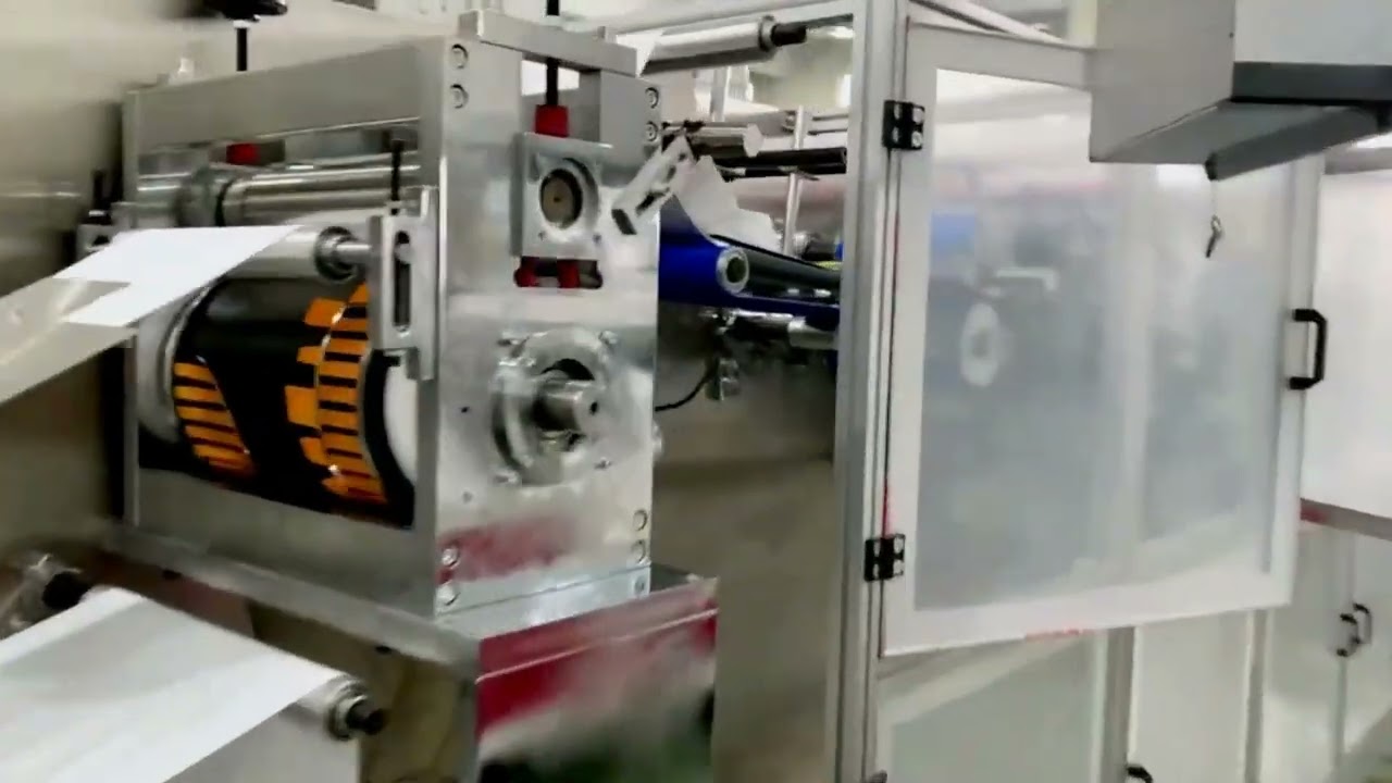 Plastic apron production equipment integrated with flow wrap packaging machine