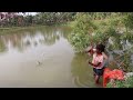 Fishing  the beautiful young girl catch hook fishing  in village big pond using food fish