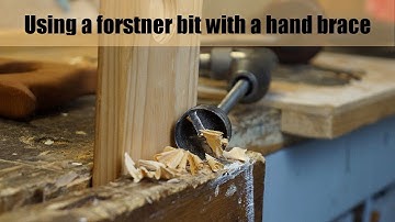 Use a forstner bit in hand drill
