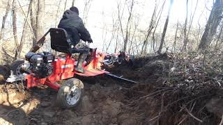 Harbor Freight trencher digging through some tough terrain.