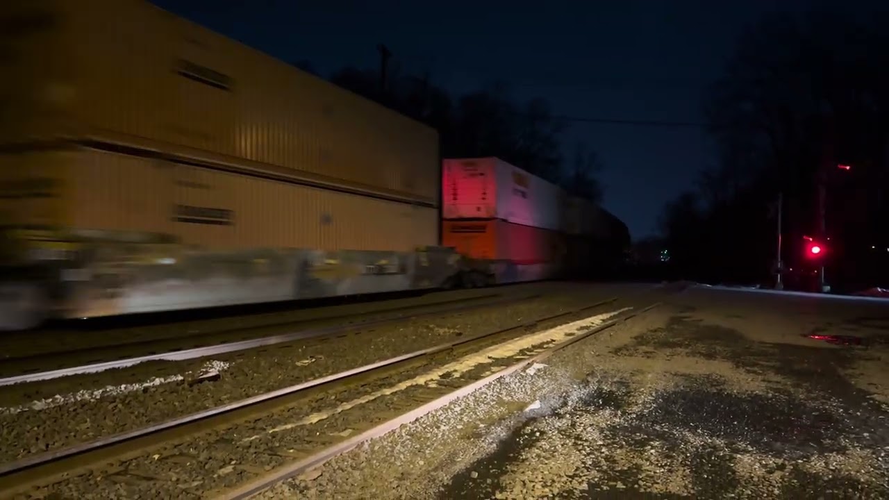 CSX 5388 ES40DC leads CSX I158 with a friendly crew flying through Piscataway 