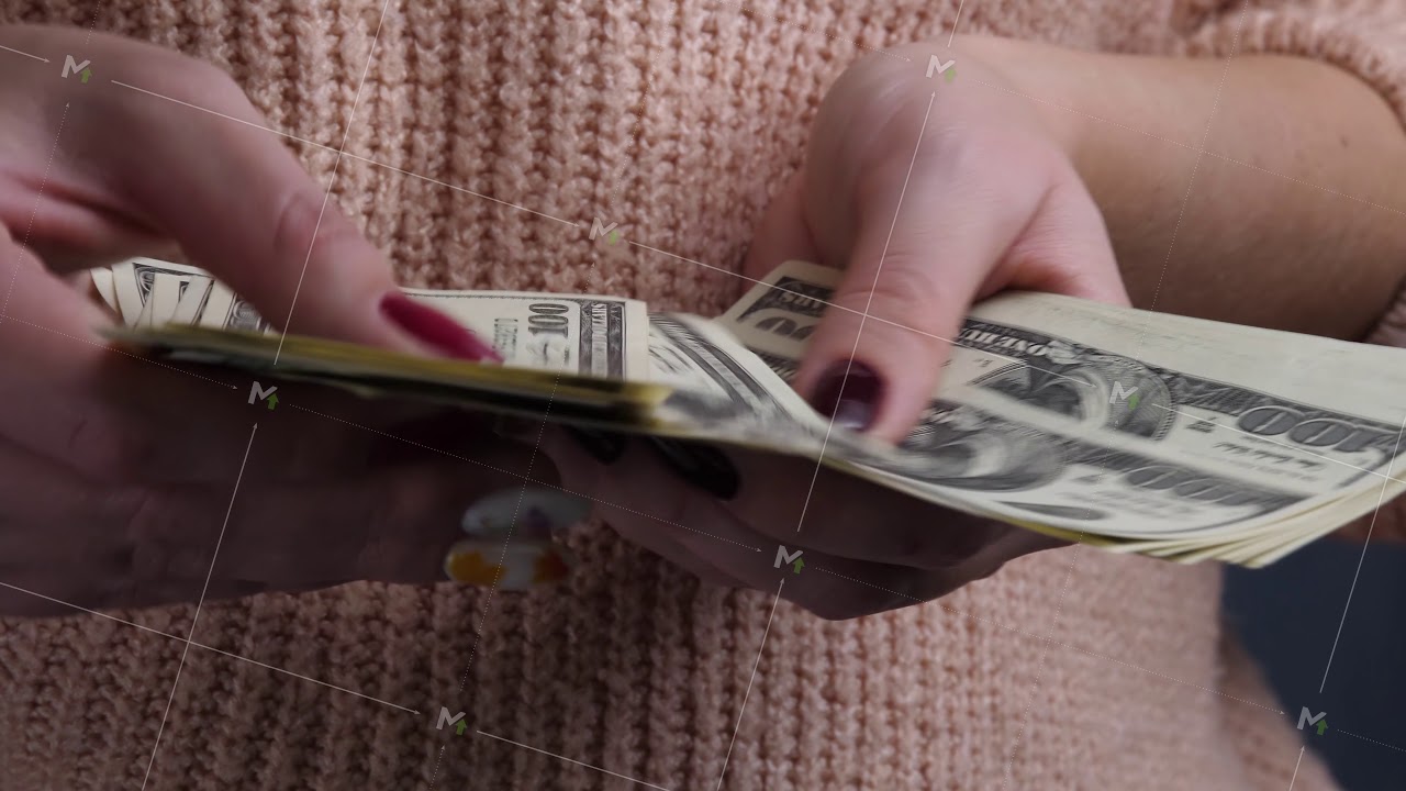 Female hands counting US Dollar bills