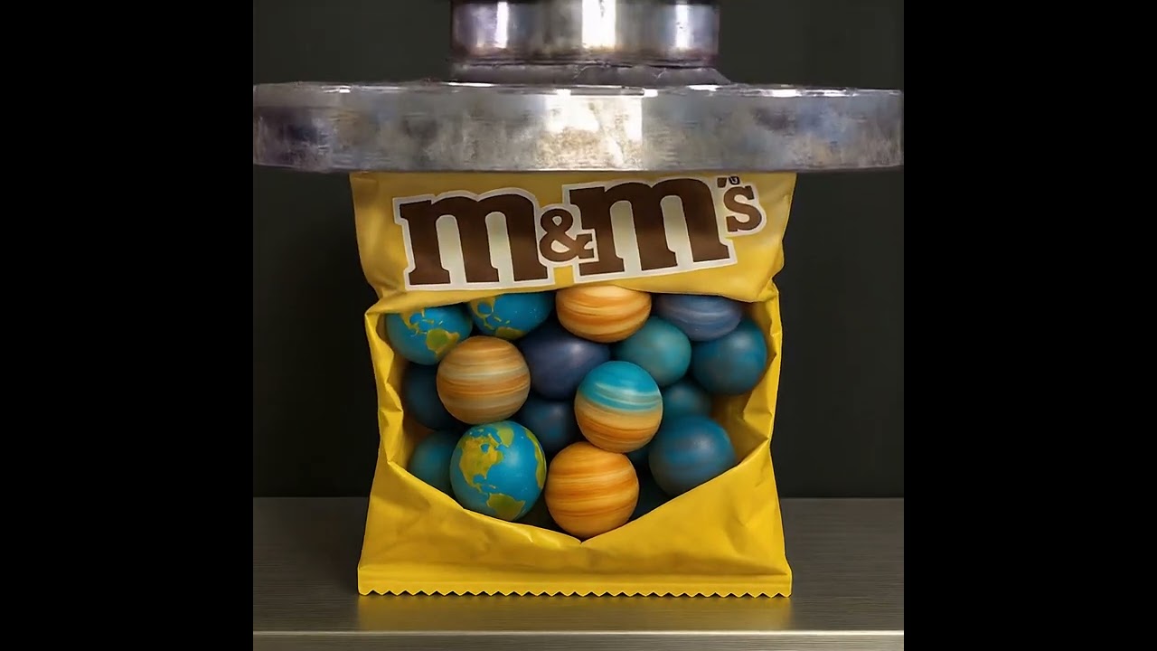 ⁣Hydraulic Press Crushes Planet M&M's