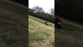 Guy rides dirt bike in park and falls off bear picnic table