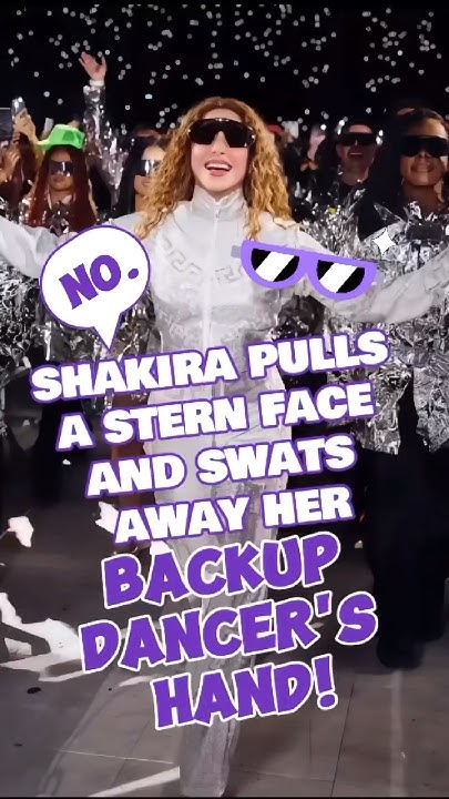 Shakira Pulls a Stern Face and Swats Away Her Backup Dancer's Hand.#