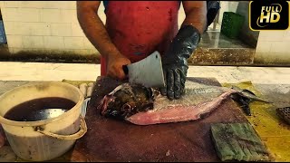 Cleaning and cutting large fish by an expert fish cutter....