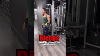 Upper body workout at gym with hand cuffs and hook grip sto