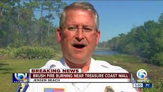 Brush fire burning near the Treasure Coast Mall
