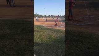 Rachel making it to first base softball